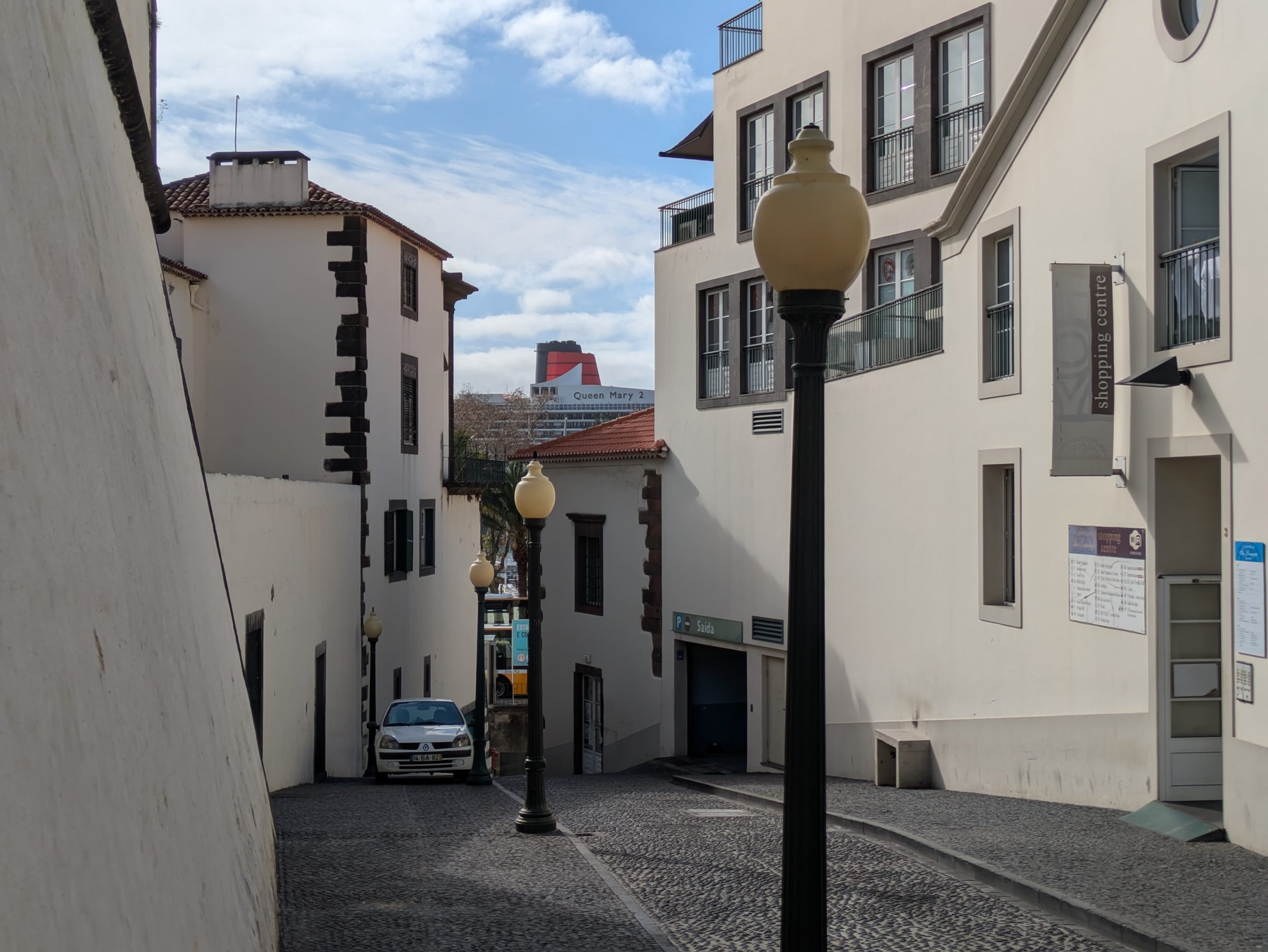 QM2 viewed through Funchal's Narrow Streets