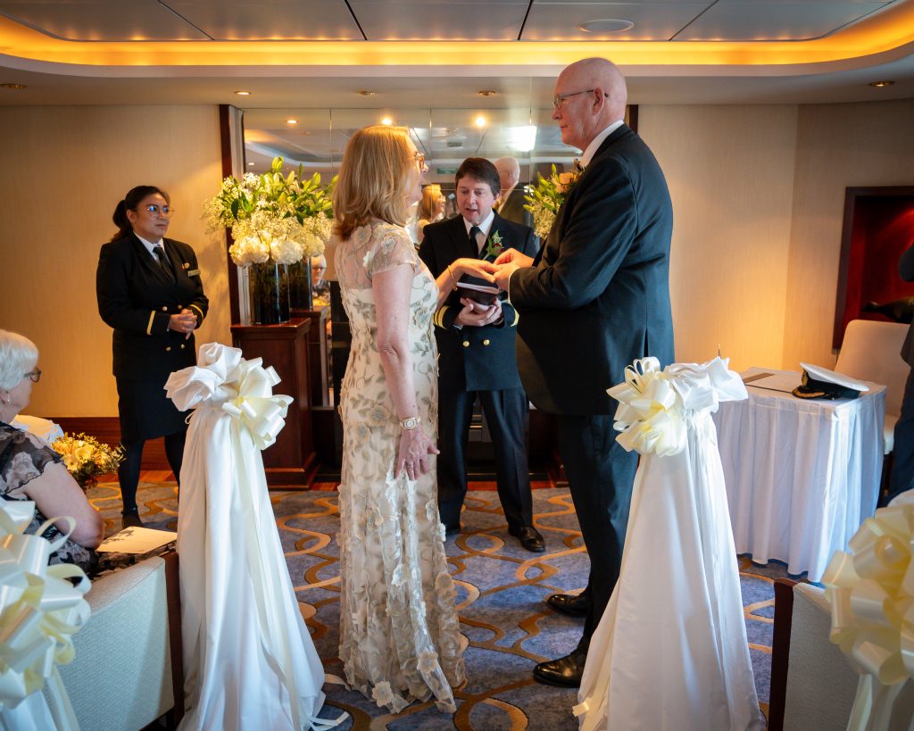 Captain Andrew Hall officiating over our wedding on QM2 19-02-2025